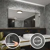 A modern bathroom vanity with a large LED-lit mirror, a white sink, and gold fixtures. Produktbild-Vorschau