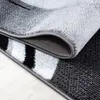 A close-up view of a rug, showing the texture and edge detail. Anteprima dell’immagine prodotto