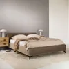 A modern bedroom setting with a bed, nightstands, and lamps. Produktbild-Vorschau