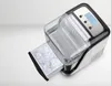 An overhead shot of a portable ice maker filled with ice. Produktbild-Vorschau