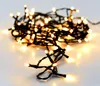 A close-up shot of a string of warm white LED lights coiled on a white surface. Náhled obrázku produktu