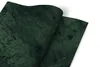 Two sheets of green marble-patterned material are shown, one partially covering the other, against a white background. Náhľad obrázku produktu