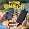 Hands holding a smartphone and a power bank outdoors. Produktbild-Vorschau