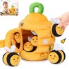 A plush beehive toy with bees, presented on a white background. Produktbild-Vorschau