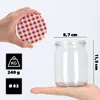 A hand holds a red and white checkered lid above a clear glass jar, with dimensions and weight information displayed. Produktbild-Vorschau