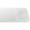A white wireless charging pad with two distinct charging areas, one circular for a watch and one rectangular for a phone. Produktbild-Vorschau