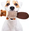 A dog holding a plush beaver toy in its mouth. Anteprima dell’immagine prodotto