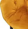 A close-up view of a mustard yellow velvet dining chair with tufted detailing. Náhled obrázku produktu