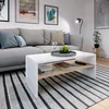 A modern living room with a grey sofa, coffee table, and striped rug. Anteprima dell’immagine prodotto