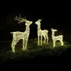 Three illuminated reindeer figures are displayed on grass at night, likely as outdoor Christmas decorations. Produktbild-Vorschau