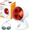 A Beurer infrared lamp and its packaging are shown, along with a pair of protective goggles. Produktbild-Vorschau