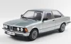A silver and blue BMW 323I E21 1980 model car is shown from a three-quarter front angle against a white background. Anteprima dell’immagine prodotto