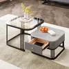 Two modern coffee tables are placed on a rug in a living room setting. Voir les images du produit