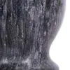 A close-up view of a dark gray granite mortar, showing its textured surface and curved shape. Voir les images du produit