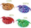 Four plush toy snakes are arranged in a grid on a white background, each with a name above it. Produktbild-Vorschau