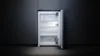 An open refrigerator with its interior light on, set against a dark background. Produktbild-Vorschau
