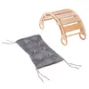 A wooden climbing arch and a gray cushion are shown against a white background. Náhled obrázku produktu
