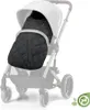 A black quilted footmuff is placed inside a stroller. Produktbild-Vorschau