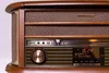 A close-up view of the front panel of a retro-style stereo system. Produktbild-Vorschau