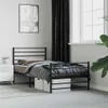 A bedroom scene with a black metal bed frame, bedding, a nightstand, and a window with curtains. Podgląd zdjęcia produktu