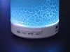 Close-up of a white Bluetooth speaker with a blue, cracked light effect. Produktbild-Vorschau