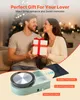 A couple is exchanging a gift in a festive setting, with a pottery wheel and accessories shown in the foreground. Produktbild-Vorschau