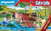 A Playmobil City Life playset depicting a playground with a ship wreck, slide, swing, and figures. Podgląd zdjęcia produktu