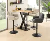 A modern dining area with a bar table and stools, set against a large window with a garden view. Produktbild-Vorschau