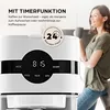 A woman is holding a mug next to a white coffee maker with a digital display. The image also includes text highlighting the timer function of the coffee maker. Náhľad obrázku produktu