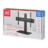 The image shows the retail packaging of a TV stand. Voir les images du produit
