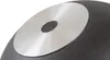 A close-up view of the bottom of a black pot with a silver metallic disc in the center. Produktbild-Vorschau