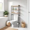 A bathroom scene featuring a toilet and a shelving unit. Náhled obrázku produktu