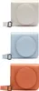 Three camera cases in different colors are displayed vertically against a white background. Produktbild-Vorschau