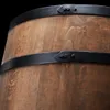 A close-up view of the wooden staves and metal bands of a barrel. Náhled obrázku produktu