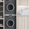 A stackable washer and dryer unit in a modern laundry room. Produktbild-Vorschau