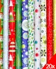 A collection of rolled up Christmas wrapping paper with various festive designs. Produktbild-Vorschau