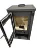 A dark gray wood-burning stove with its door open, revealing the interior. Náhled obrázku produktu