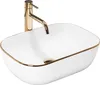 A white oval basin with a gold rim and a gold faucet. Náhľad obrázku produktu