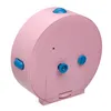 The back of a pink analog alarm clock with blue buttons and knobs. Podgląd zdjęcia produktu