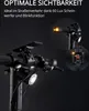 Close-up view of an electric scooter's handlebars and front light, with inset images showing the turn signals and rear light. Produktbild-Vorschau