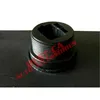 A black plastic component with threaded sides and a hexagonal opening at the top, placed on a black surface. Voir les images du produit