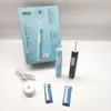 A collection of Oral-B electric toothbrushes and accessories laid out on a white surface, with a product box in the background. Anteprima dell’immagine prodotto