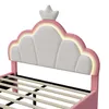 Close-up of a pink upholstered bed frame with a cloud-shaped headboard and a crown detail. Náhľad obrázku produktu