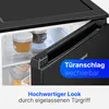 Close-up of a black refrigerator door with an open compartment showing jars and food items. Overlay text highlights features. Produktbild-Vorschau