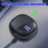 A black charging case for wireless earbuds is shown on a desk next to a laptop, with a charging cable plugged in. Produktbild-Vorschau