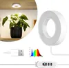 A collage showing a plant light in use, a close-up of the light, a USB connector, and a light spectrum graph. Produktbild-Vorschau