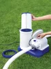 A person is shown assembling a pool filter pump system on a grassy lawn. Voir les images du produit