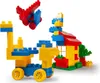 A collection of building blocks arranged to form a toy airplane, a toy house with a tree, and a toy vehicle. Anteprima dell’immagine prodotto