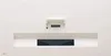 The back of a white LG projector with a black lens and a white mounting bracket. Produktbild-Vorschau