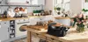 A kitchen scene with a waffle maker on a wooden table. Podgląd zdjęcia produktu